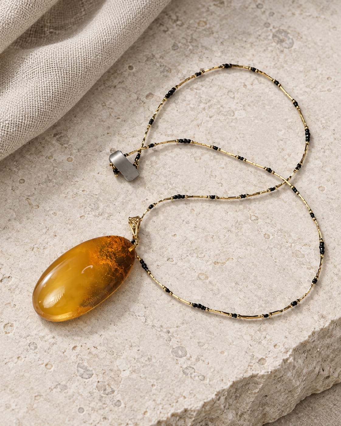 Vakars Necklace · Cognac Amber with Sapphire