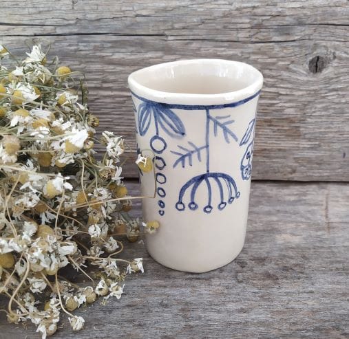 Cup with meadow flowers