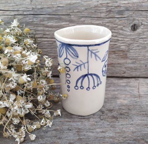 Cup with meadow flowers