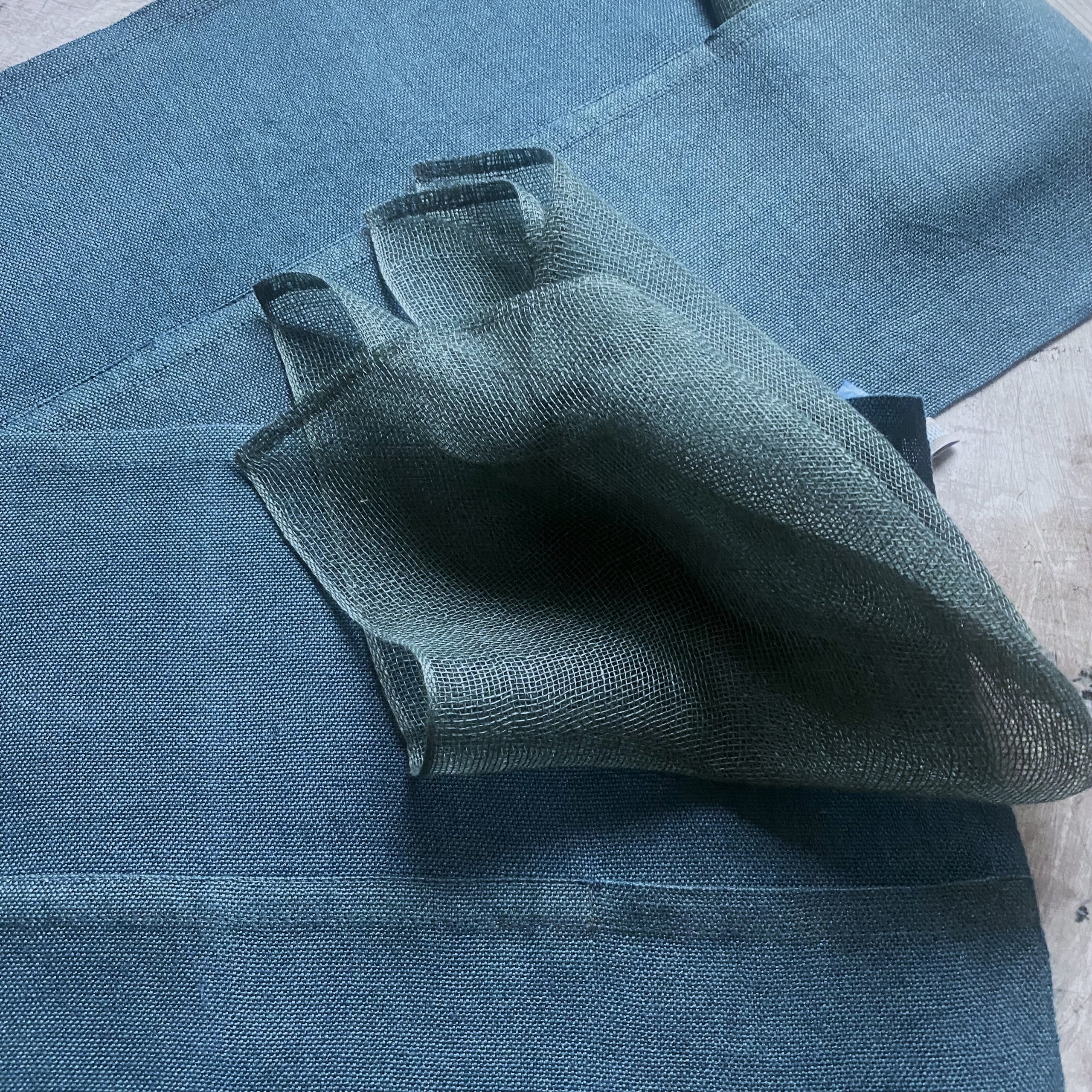 A two-piece bluish Placemat set 50x37 cm